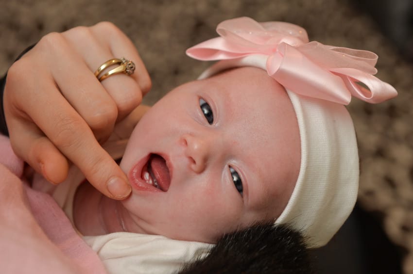 First time mum Samantha Lines, 29 from Rugby in Warwickshire was left shocked when she discovered her newborn baby Ella-Rose already has two of her front teeth. See NTI story NTITEETH; A mother has been celebrating the birth of a 'miracle' baby - born with TWO front TEETH. Samantha Lines, 29, gave birth to Bella-Rose at George Eliot Hospital, Nuneaton, on February 6. The barmaid, who has previously had trouble conceiving and had a miscarriage, described the tot as her "little miracle". However, after coming round from a long birth, delivered by casarean section, Ms Lines was amazed to discover that her child had two front teeth. The new mother, of Rugby, Warks., said: "It was a complete surprise. "It was a cesarean section, so I was completely delirious with all the morphine and other drugs.