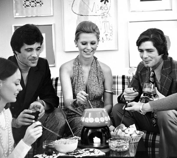 01 Jan 1974 --- 1970s fondue party with several couples --- Image by © ClassicStock/Corbis