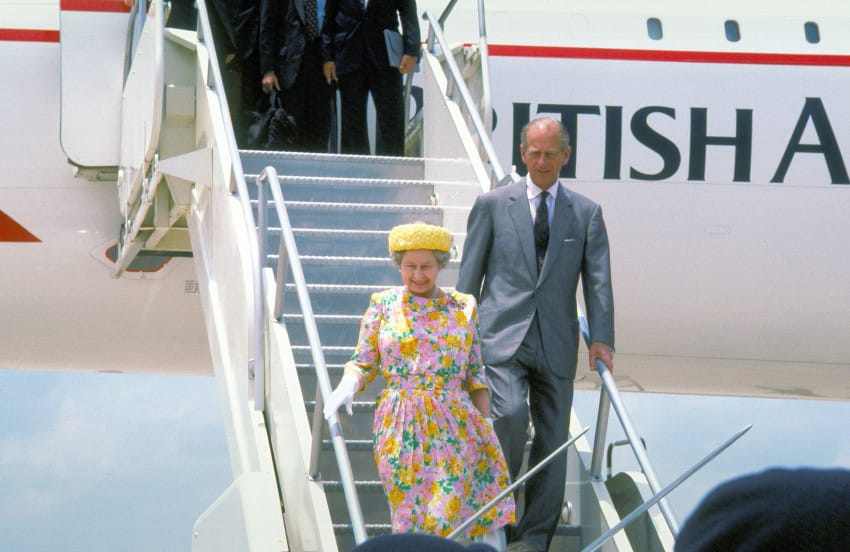 England's Queen Elizabeth II and her husbaand, Prince Philip, Duke of Edinburgh, disembark from a British Airways Concorde supersonic transport aircraft upon their arrival for a royal visit.