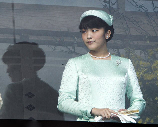 FILE - In this Dec. 23, 2011, file photo, Japan's Princess Mako stands on a bulletproofed balcony at the Imperial Palace in Tokyo to greet well-wishers who throng to the palace compound to celebrate Emperor Akihito's 78th birthday. Mako, the granddaughter of Emperor Akihito, is getting married to an ocean lover who can ski, play the violin and cook, according to public broadcaster NHK TV. The Imperial Household Agency declined to confirm the report Tuesday, May 16, 2017. (AP Photo/Koji Sasahara, File)
