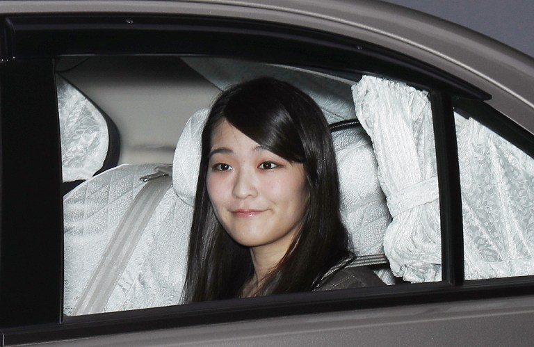 Japanese Princess Mako leaves her home in Tokyo on May 18, 2017. The upcoming engagement of Emperor Akihito's granddaughter to her college sweetheart has brought joy to Japan but is highlighting the vulnerability of the male-dominated imperial family at a sensitive time for the ancient institution. / AFP PHOTO / JIJI PRESS / STR / Japan OUT