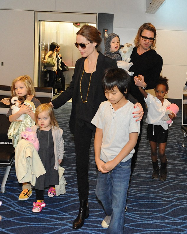 Brad Pitt, Angelina Jolie and their six children, Maddox, Pax, Zahara, Shiloh, Knox and Vivienne, leave at Haneda International Airport in Tokyo, Japan. The "Brangelina" family enjoyed their very limited 48 hours stay by shopping at famous local toy shops while Brad Pitt promoted his film "Moneyball". Pictured: Brad Pitt, Angelina Jolie and kids, Shiloh, Vivienne,  Maddox, Knox and Zahara Ref: SPL333209  101111   Picture by: Edo Kat / Splash News Splash News and Pictures Los Angeles:	310-821-2666 New York:	212-619-2666 London:	870-934-2666 photodesk@splashnews.com 