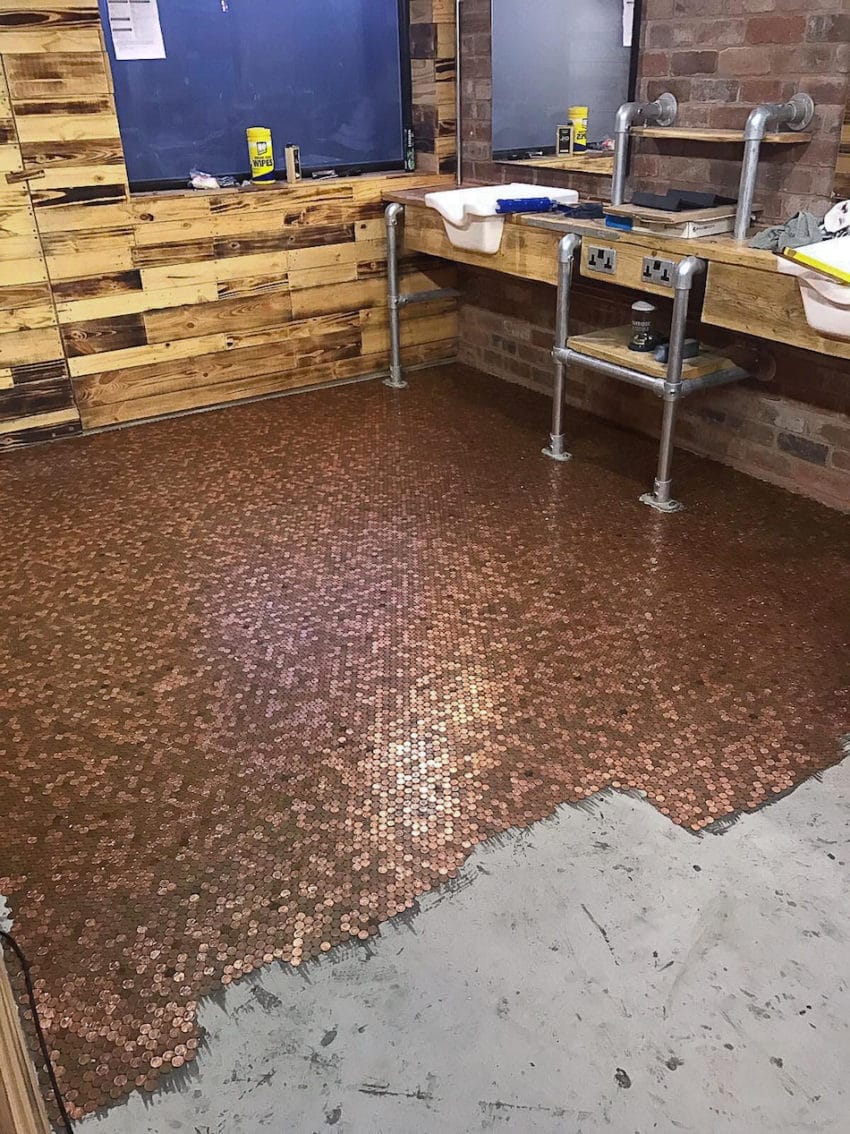 COLLECT - The progress of the laying of the penny floor, at the barber shop BS4,  Lower Gornal, Dudley, West Midlands.  See NTI story NTIPENNIES.  A new barber shop has a very unique feature - a floor made out of 70,000 pennies.  The eye-catching floor at BS4 in Dudley, West Midlands, took three-and-a-half months to make.  Brett Davies, who has been in the business for 26 years, also has shops in Wordsley, Wombourne and Wall Heath but he said this was the "most extravagant" of the four.