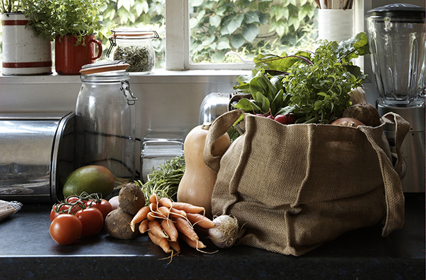 fresh vegetables in canvas bag on kitchen counter