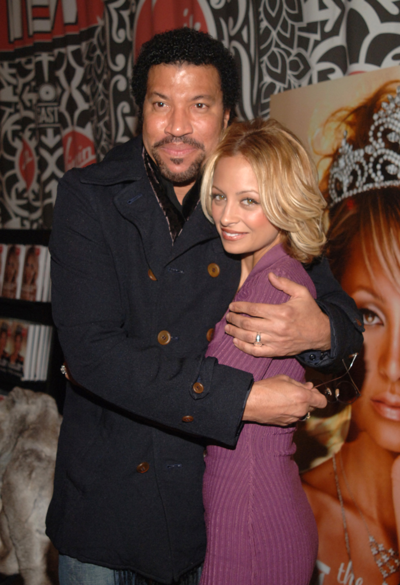 NEW YORK - NOVEMBER 10: Lionel Richie and Nicole Richie share a moment at the "The Truth About Diamonds" book signing at the Virgin Mega Store in Times Square on November 10, 2005 in New York City. (Photo by Brad Barket/Getty Images)