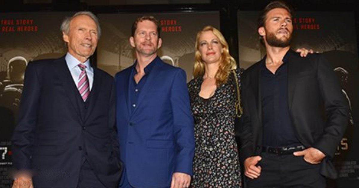 Clint Eastwood walks the poses for the camera amidst his six children